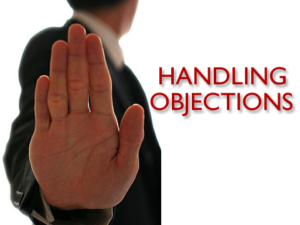 the palm of a hand signifying objections in sales