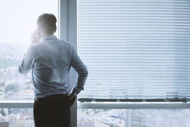 a man talking over the phone to handle sales objections